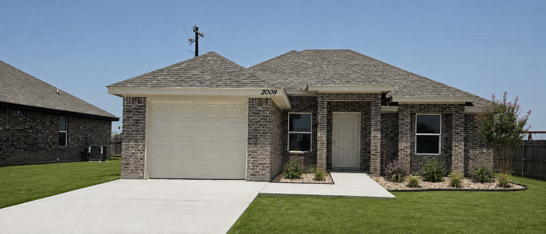 Design preview showing new grass across a front lawn